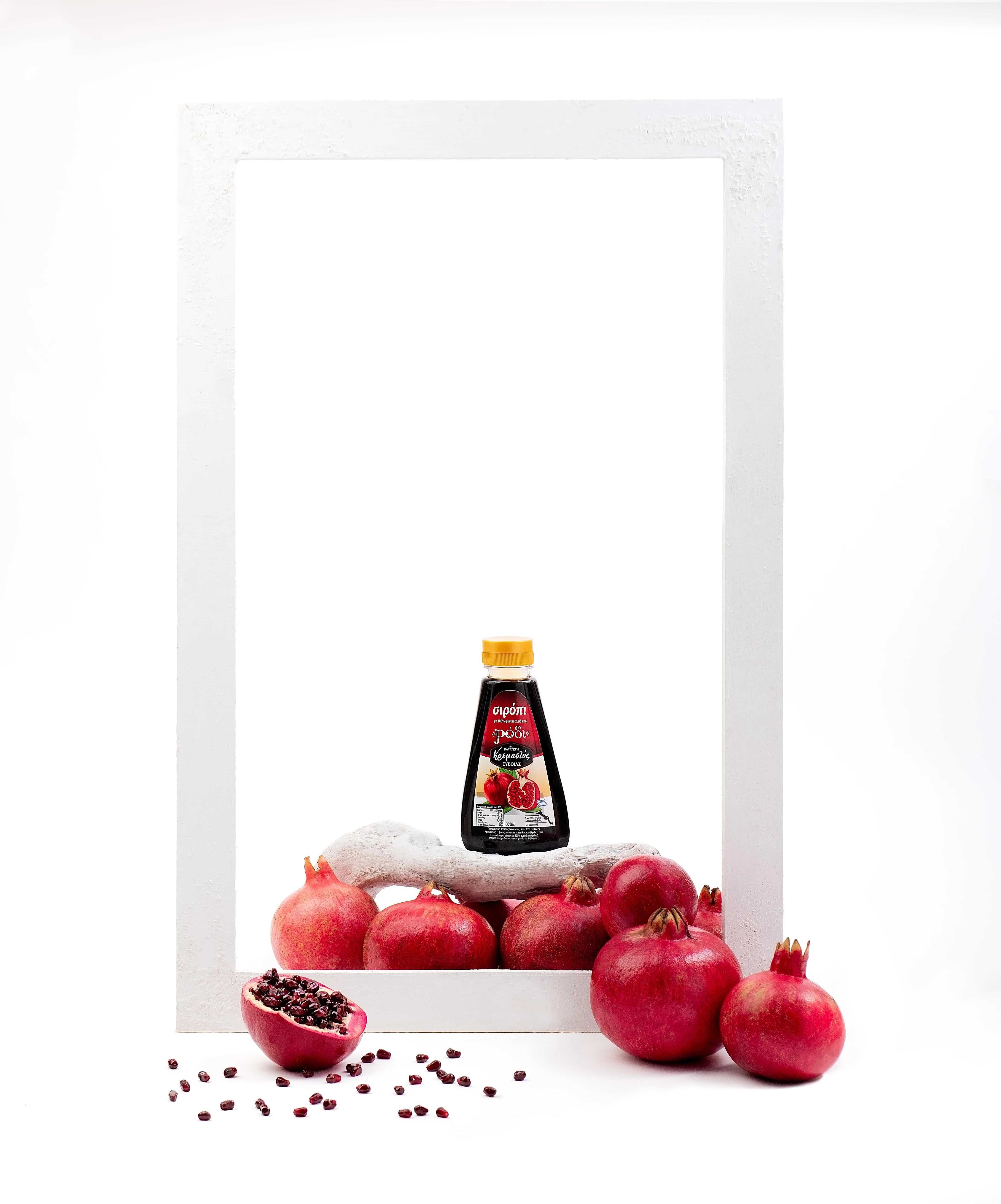 syrup bottle on pomegranates