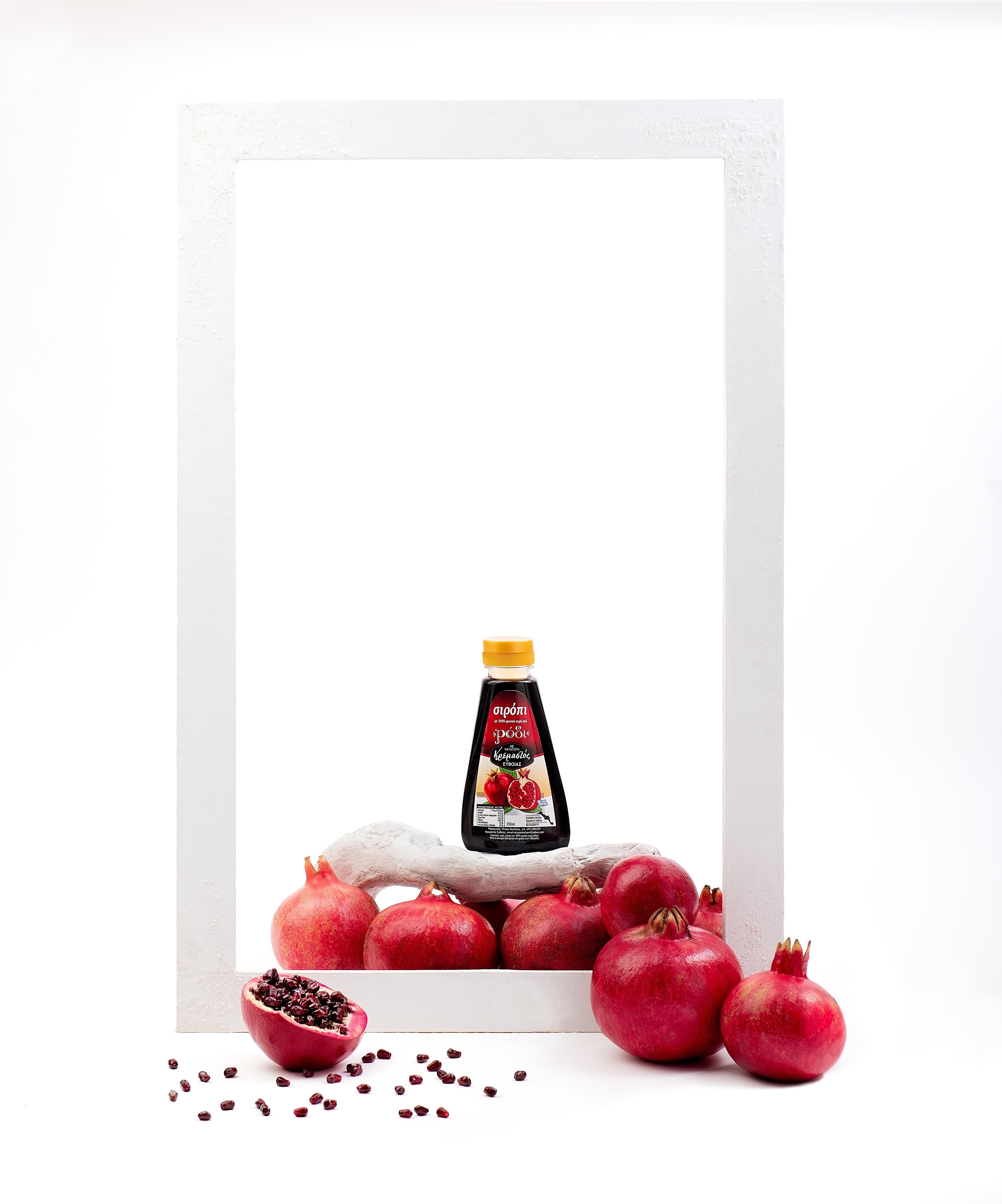 syrup bottle on pomegranates
